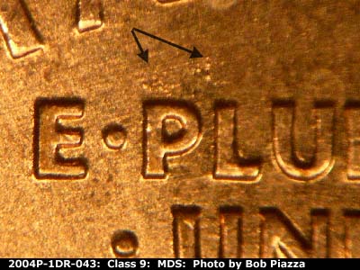 Die-stage B marker on 2004P•1DR•043 (2004 Doubled Die Reverse).