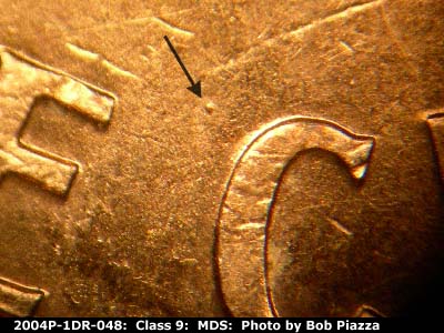 Die-stage B marker on 2004P•1DR•048 (2004 Doubled Die Reverse).