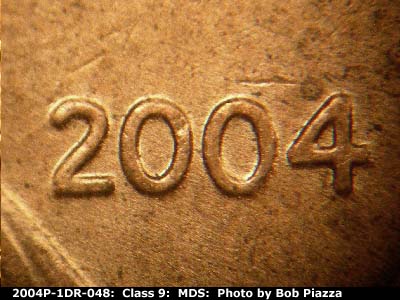 Die-stage B marker on 2004P•1DR•048 (2004 Doubled Die Reverse).