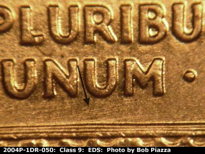 Die-stage A marker on 2004P•1DR•050 (2004 Doubled Die Reverse).