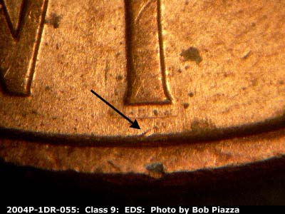Die-stage A marker on 2004P•1DR•055 (2004 Doubled Die Reverse).