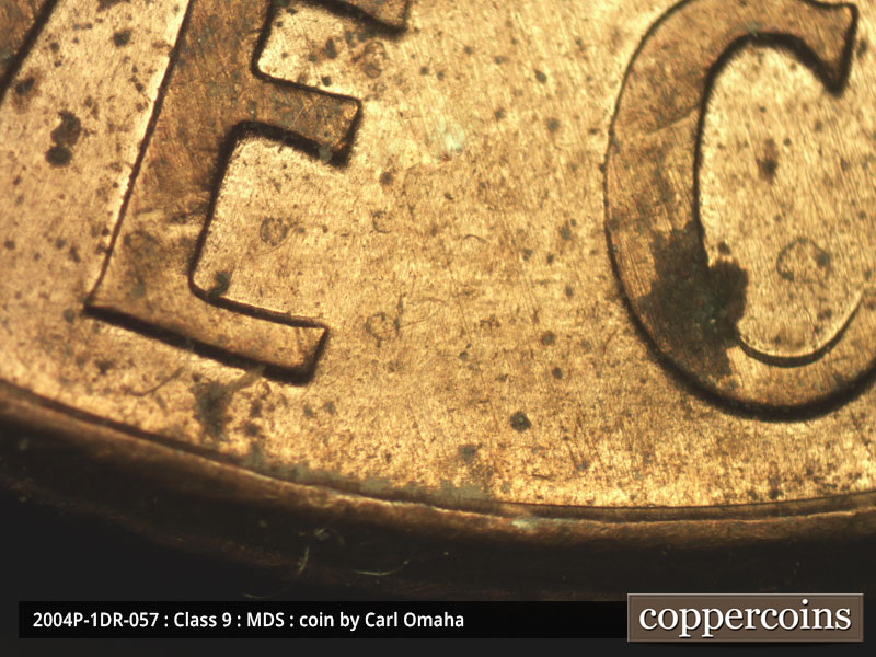 Die-stage B marker on 2004P•1DR•057 (2004 Doubled Die Reverse).