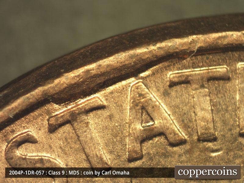 Die-stage B marker on 2004P•1DR•057 (2004 Doubled Die Reverse).