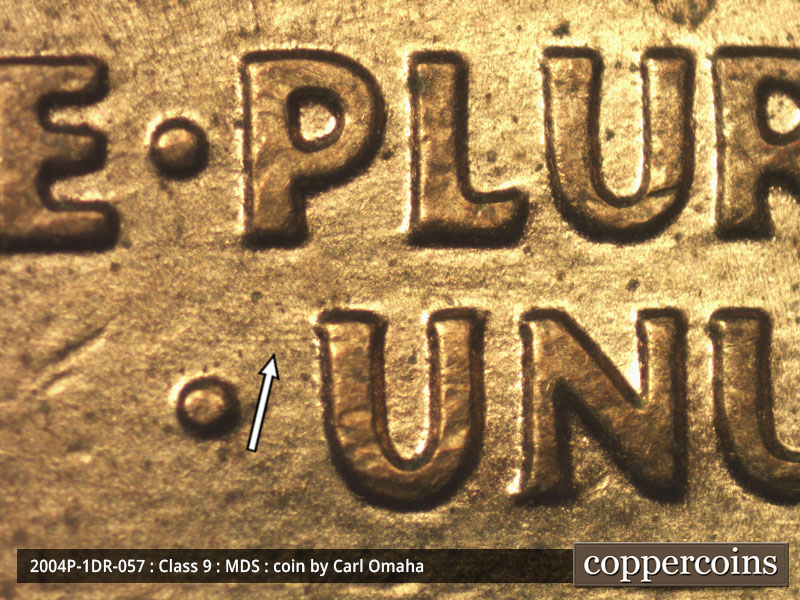 Die-stage B marker on 2004P•1DR•057 (2004 Doubled Die Reverse).