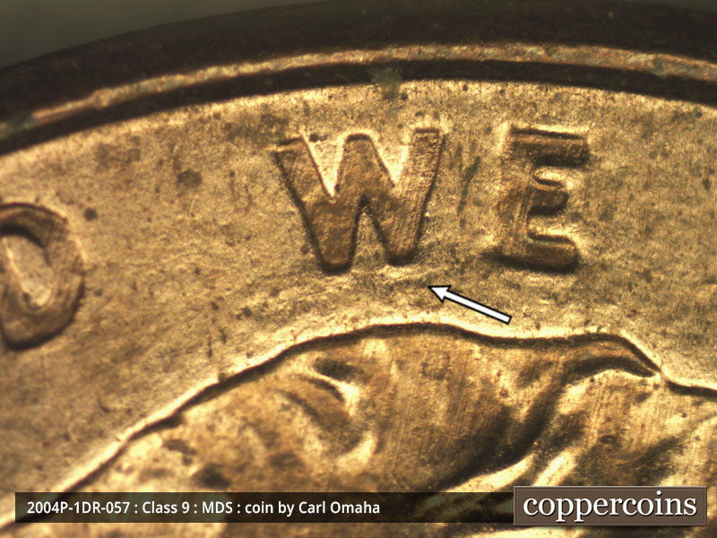 Die-stage B marker on 2004P•1DR•057 (2004 Doubled Die Reverse).