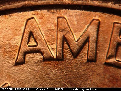 Die-stage B marker on 2005P•1DR•012 (2005 Doubled Die Reverse).