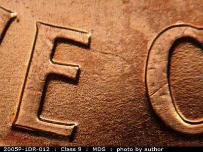 Die-stage B marker on 2005P•1DR•012 (2005 Doubled Die Reverse).