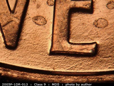 Die-stage B marker on 2005P•1DR•013 (2005 Doubled Die Reverse).