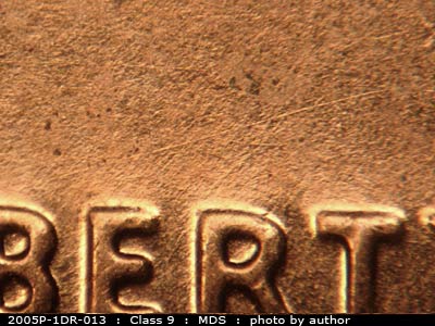 Die-stage B marker on 2005P•1DR•013 (2005 Doubled Die Reverse).