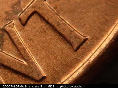 Die-stage B marker on 2005P•1DR•019 (2005 Doubled Die Reverse).