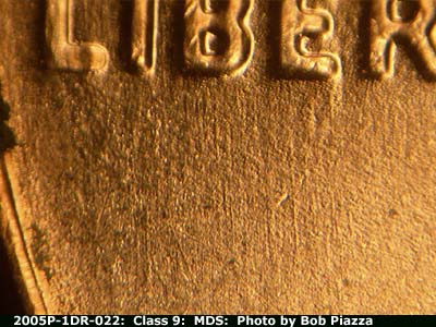 Die-stage B marker on 2005P•1DR•022 (2005 Doubled Die Reverse).