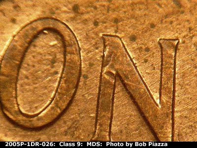 Die-stage B marker on 2005P•1DR•026 (2005 Doubled Die Reverse).