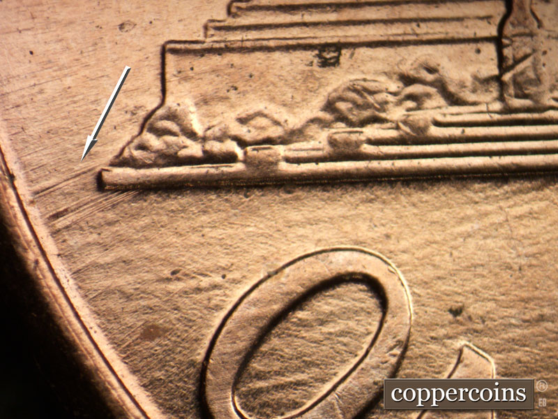 Die-stage B marker on 2005P•1DR•036 (2005 Doubled Die Reverse).
