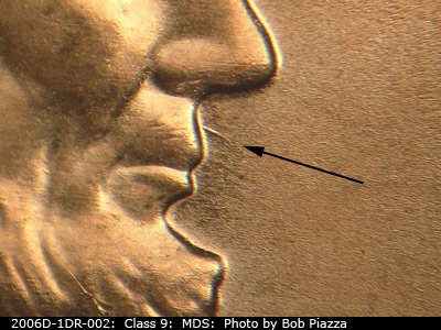 Die-stage B marker on 2006D•1DR•002 (2006 Doubled Die Reverse).