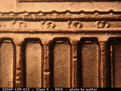 Die-stage B marker on 2006P•1DR•010 (2006 Doubled Die Reverse).