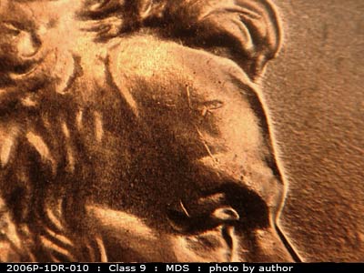 Die-stage B marker on 2006P•1DR•010 (2006 Doubled Die Reverse).