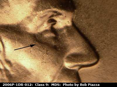 Die-stage B marker on 2006P•1DR•012 (2006 Doubled Die Reverse).