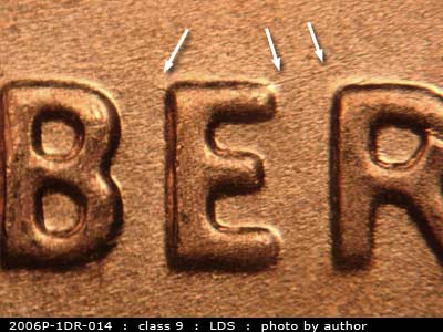 Die-stage C marker on 2006P•1DR•014 (2006 Doubled Die Reverse).