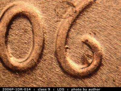 Die-stage C marker on 2006P•1DR•014 (2006 Doubled Die Reverse).