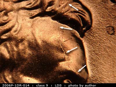 Die-stage C marker on 2006P•1DR•014 (2006 Doubled Die Reverse).
