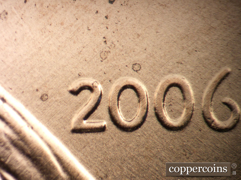 Die-stage B marker on 2006P•1DR•040 (2006 Doubled Die Reverse).