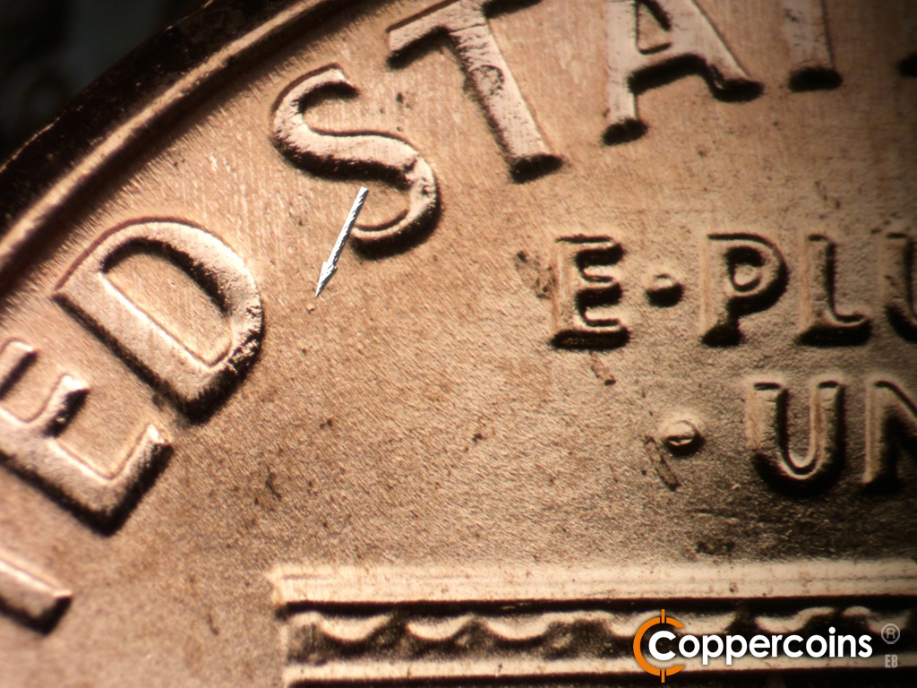 Die-stage B marker on 2006P•1DR•041 showing Small die dot between the D in UNITED and the first S in STATES.