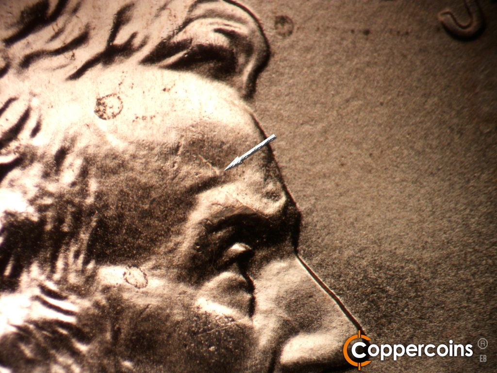 Die-stage B marker on 2006P•1DR•041 showing Die crack on forehead.