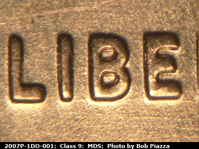 Die-stage B marker on 2007P•1DO•001 (2007 Doubled Die Obverse).