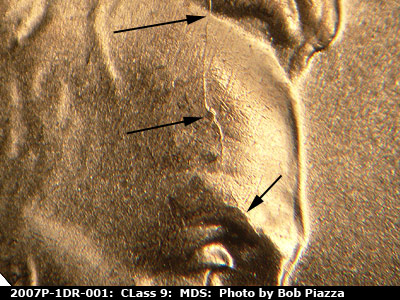 Die-stage B marker on 2007P•1DR•001 (2007 Doubled Die Reverse).