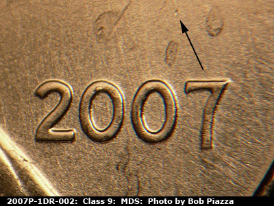 Die-stage B marker on 2007P•1DR•002 (2007 Doubled Die Reverse).