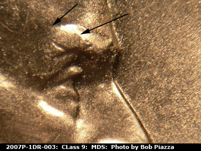 Die-stage B marker on 2007P•1DR•003 (2007 Doubled Die Reverse).