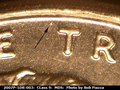 Die-stage B marker on 2007P•1DR•003 (2007 Doubled Die Reverse).