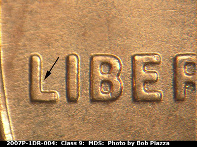 Die-stage B marker on 2007P•1DR•004 (2007 Doubled Die Reverse).