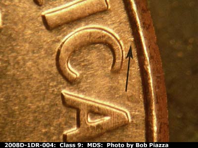 Die-stage B marker on 2008D•1DR•004 (2008 Doubled Die Reverse).