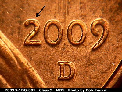 Die-stage B marker on 2009D•1DO•001 (2009 Doubled Die Obverse).