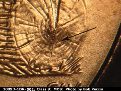 Die-stage B marker on 2009D•1DR•002 (2009 Doubled Die Reverse).
