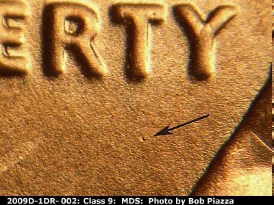 Die-stage B marker on 2009D•1DR•002 (2009 Doubled Die Reverse).
