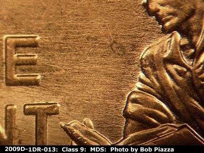 Die-stage B marker on 2009D•1DR•013 (2009 Doubled Die Reverse).