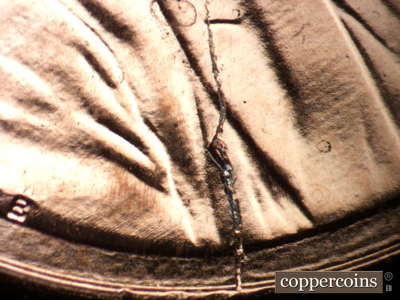 Die-stage C marker on 2009P•1DO•002 (2009 Doubled Die Obverse).