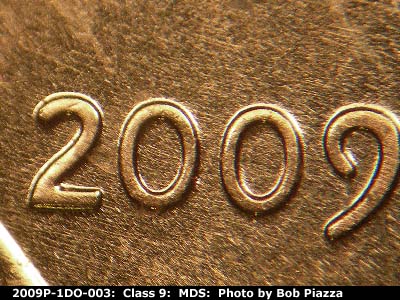Die-stage B marker on 2009P•1DO•003 (2009 Doubled Die Obverse).