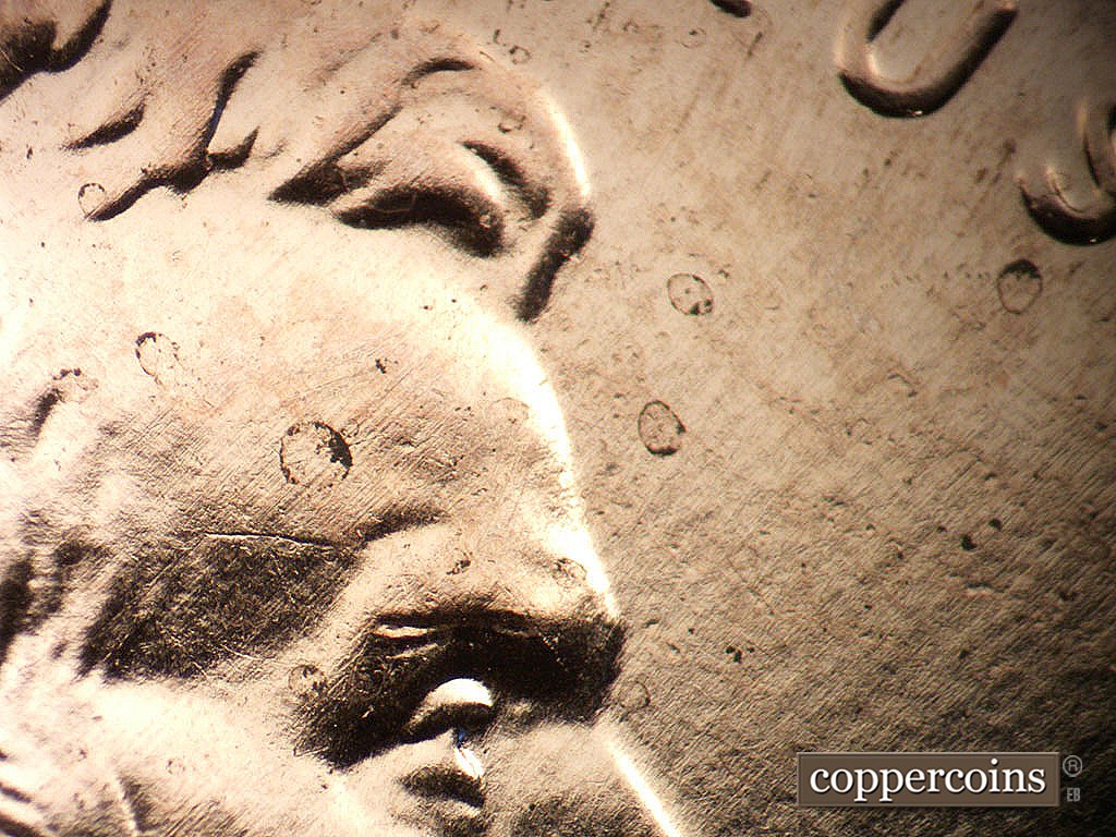 Die-stage A marker on 2009P•1DO•011 showing Light die crack starting to form on forehead.