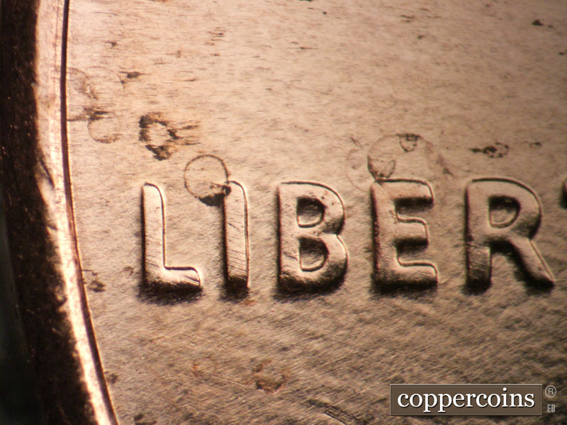 Die-stage B marker on 2009P•1DO•011 (2009 Doubled Die Obverse).