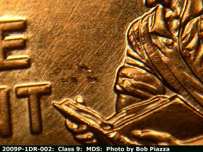 Die-stage B marker on 2009P•1DR•002 (2009 Doubled Die Reverse).