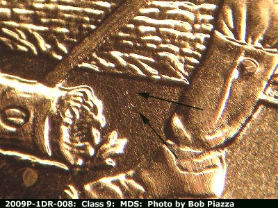 Die-stage B marker on 2009P•1DR•008 showing Small die gouges to the right of the mallet.