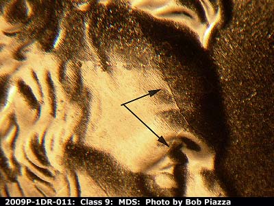 Die-stage B marker on 2009P•1DR•011 (2009 Doubled Die Reverse).