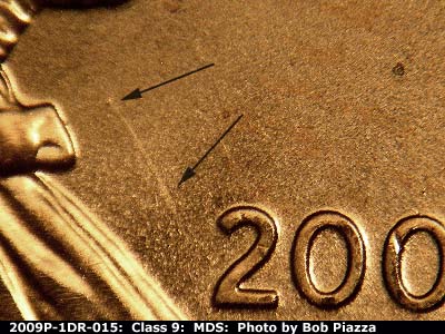 Die-stage B marker on 2009P•1DR•015 (2009 Doubled Die Reverse).