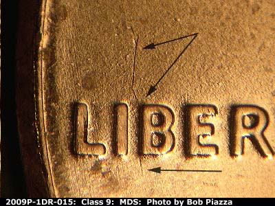 Die-stage B marker on 2009P•1DR•015 (2009 Doubled Die Reverse).