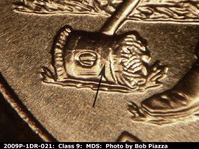 Die-stage B marker on 2009P•1DR•021 (2009 Doubled Die Reverse).