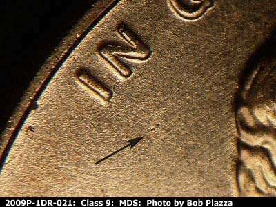 Die-stage B marker on 2009P•1DR•021 (2009 Doubled Die Reverse).