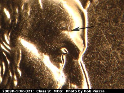Die-stage B marker on 2009P•1DR•021 (2009 Doubled Die Reverse).
